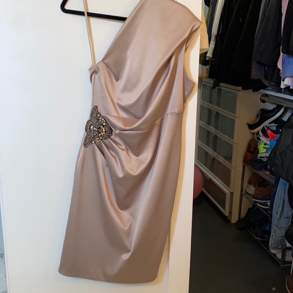 Beautiful one shoulder champagne colored dress with appliqué on the side